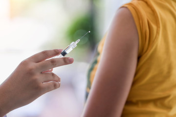 Closeup of doctor hand are vaccinations to patients using the syringe.Medical concept