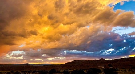 golden sunset clouds over rocks