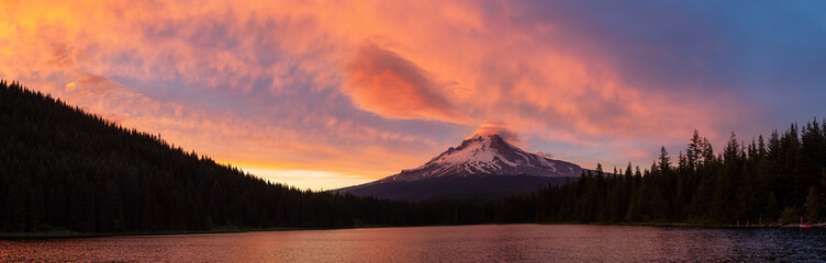 Beautiful Panoramic Landscape View of Mt Hood during a dramatic cloudy sunset. Taken from Trillium Lake, Mt. Hood National Forest, Oregon, United States of America.