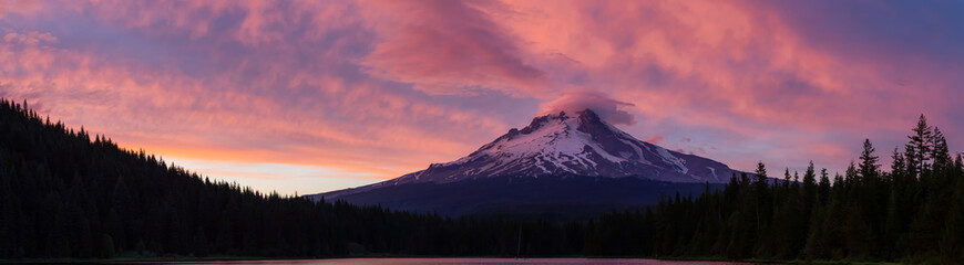 Beautiful Panoramic Landscape View of Mt Hood during a dramatic cloudy sunset. Taken from Trillium Lake, Mt. Hood National Forest, Oregon, United States of America.