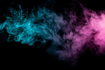 Colored background with winding clouds of smoke from patterns of different forms of pink, green and blue colors with tongues of flame on a black isolated background. Print for t-shirt.