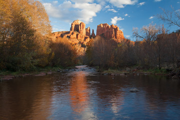 Cathedral Rock from Red Rock Crossing in Sedona, Arizona on a late autumn afternoon under a beautiful cloudscape.
