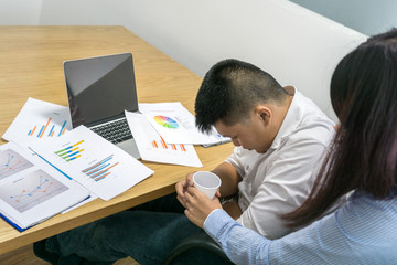 Asian businessman feel hurt in the office