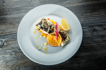 top view tasty stuffed sea fish on pickled pepper garnish