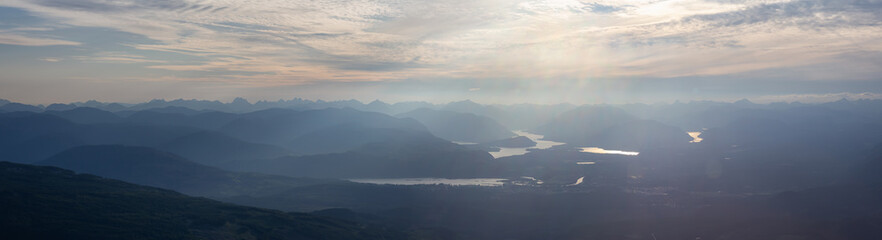 Beautiful Panoramic view of Canadian Mountain Landscape during a vibrant summer sunset. Taken at Mt Arrowsmith, near Nanaimo and Port Alberni, Vancouver Island, BC, Canada.