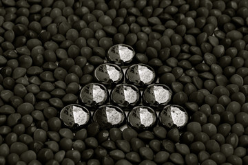 Triangle of shiny beads in black and white