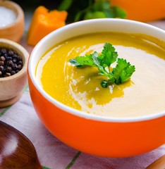 Pumpkin soup served on the table in bowl