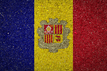 National flag of Andorra on a stone background.The concept of national pride and symbol of the...