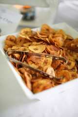 Catered Food Fried Plantains Dried Banana Chips in a Minimalistic White Bowl