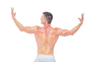 Powerful back. Strong Athletic Man - Fitness Model showing his perfect body isolated on white background with copyspace. Bodybuilder man with perfect abs, shoulders,biceps, triceps and chest.