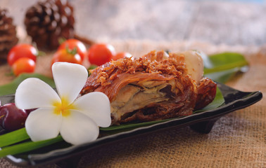 Grilled chicken with fresh vegetables. Baked chicken meat with tomatoes cherry. Homemade meat on wooden table.