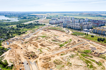 top view of suburb area. construction of new city road. panoramic aerial photography