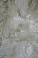 Rusty concrete surface, striped relief. Texture engraved lines on cement wall