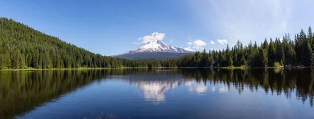 Beautiful Panoramic Landscape View of a Lake with Mt Hood in the background during a sunny summer day. Taken from Trillium Lake, Mt. Hood National Forest, Oregon, United States of America.