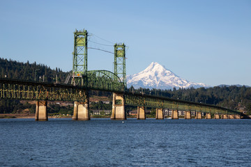 Beautiful View of Hood River Bridge going over Columbia River with Mt Hood in the background. Taken in White Salmon, Washington, USA. - obrazy, fototapety, plakaty