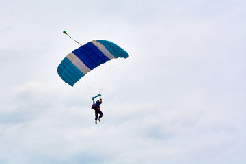 skydiver hovers in the sky