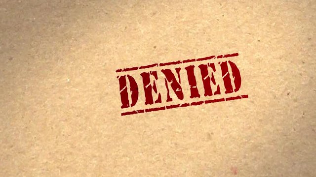 Motion graphics - CGI 3D animation of a file being rubber stamped DENIED