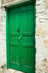 Old wooden door in authentic shapes and colors