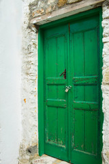 Old wooden door in authentic shapes and colors