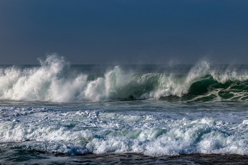 Foamy Atlantic waves next to Nazare, Portugal.
