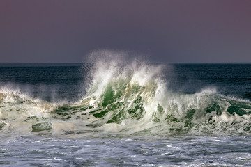 Foamy Atlantic waves next to Nazare, Portugal.