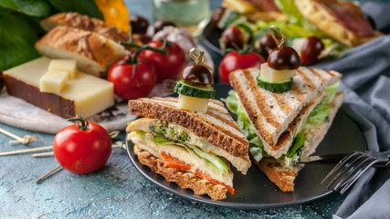 Food banner toasts with scrambled eggs, vegetables and cheese. Tomatoes and spices. Delicious breakfast or snack