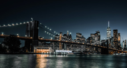 Brooklyn Bridge as night just starts to fall over New York City