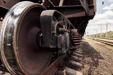 Fototapeta na wymiar chassis, wheels of a railway car, rails - the concept of transportation and shipping