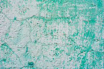 Texture of a concrete wall with cracks and scratches which can be used as a background