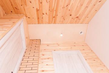 Fototapeta na wymiar Interior with a combination of white wooden doors, beige decorative brick and wooden lining of pine