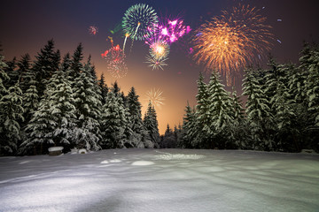 Winter night landscape with forest, pink polar light and fireworks over the taiga. New Year card with forest, fireworks and pink sky. - 280973736