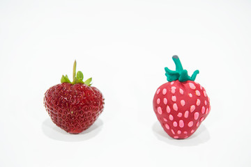 Comparison of two strawberries - Real and Fake.
