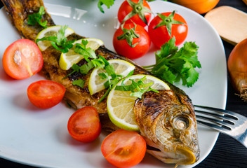 Fried fish served on the plate