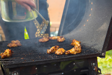 Meat and vegetables cooked on a barbecue