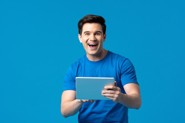 American man surfing the internet with tablet computer