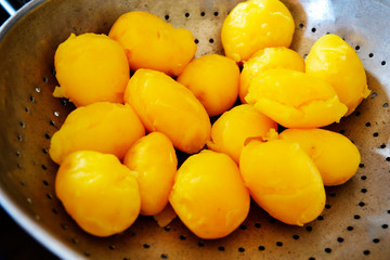 Boiled potatoes in a pan, close-up.