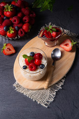 delicious milk rice with different berries and red fruit jelly