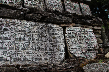 Mani Stones of Buddhism with six syllabled mantra Om Mani Padme Hum (means-Praise to the Jewel in...