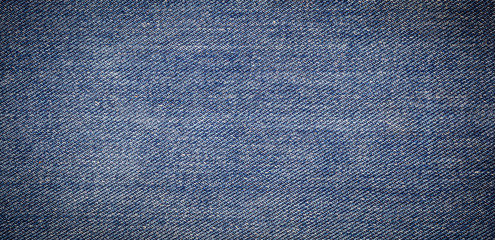 panorama of old blue jeans background and texture
