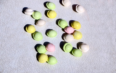 small colored dumplings on white background. food for children, festive and Christmas parties.