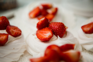 white cake decorated with fresh strawberries. meringue, dessert, marshmallows