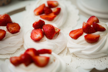 white cake decorated with fresh strawberries. meringue, dessert, marshmallows