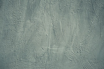 Gray background, grunge concrete wall. Rough scabrous texture. Dirty painted wall. Acrylic paint pattern on card in modern style. Scratched surface. Cement texture.