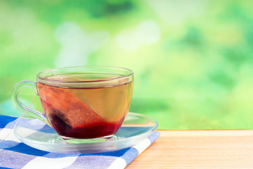 herbal tea bag and green background