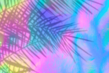 Trendy colored holographic background with palm leaves shadows in 90s style. Synthwave. Vaporwave style. Retrowave, retro futurism, webpunk