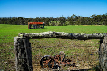 old derelict timber farm house abandoned in the countryside