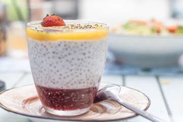 Chia seed pudding with strawberry. Healthy food. Light background.
