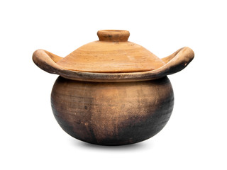old pottery clay pot with a lid ancient style for food cooking or herbal medicine preparation with smut from use on stove charcoal from Thailand isolated on white background.