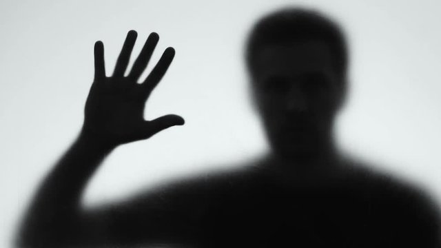 Psychopath shadow behind glass wall, mental disorder, horror mystery, nightmare