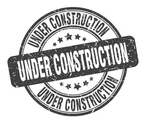 under construction stamp. under construction round grunge sign. under construction